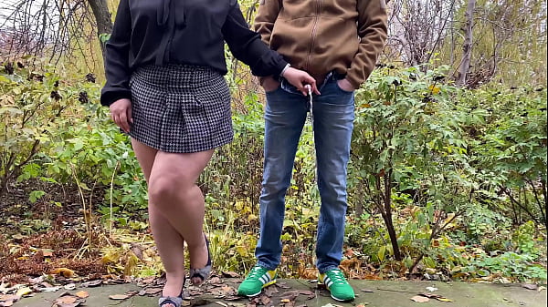 Holding His Cock While He Pisses In Her Skirt