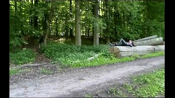 Two girls in latex touch each other