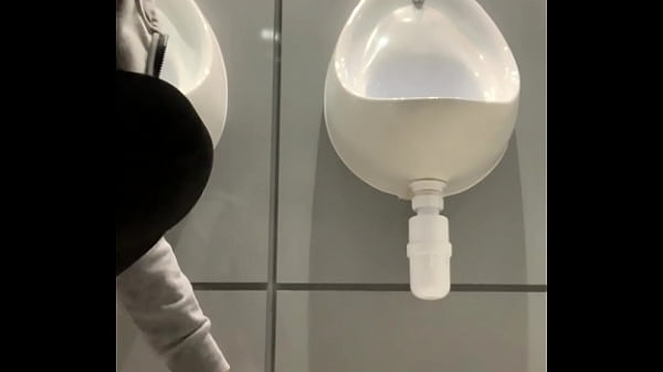 thumb drinking from t he urinal