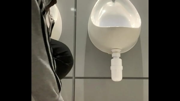 thumb drinking from t he urinal