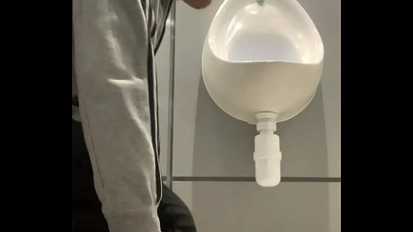 thumb drinking from t he urinal