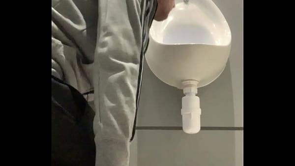 thumb drinking from t he urinal
