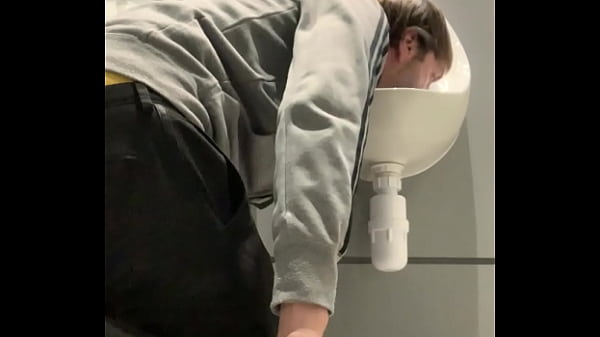 thumb drinking from t he urinal