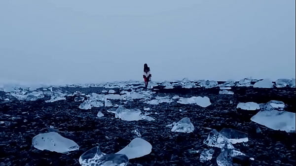 black haired girl and dove in the snow