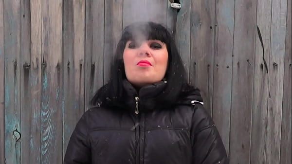 A MILF smokes and cums. Amateur fetish masturbation of a hairy pussy.