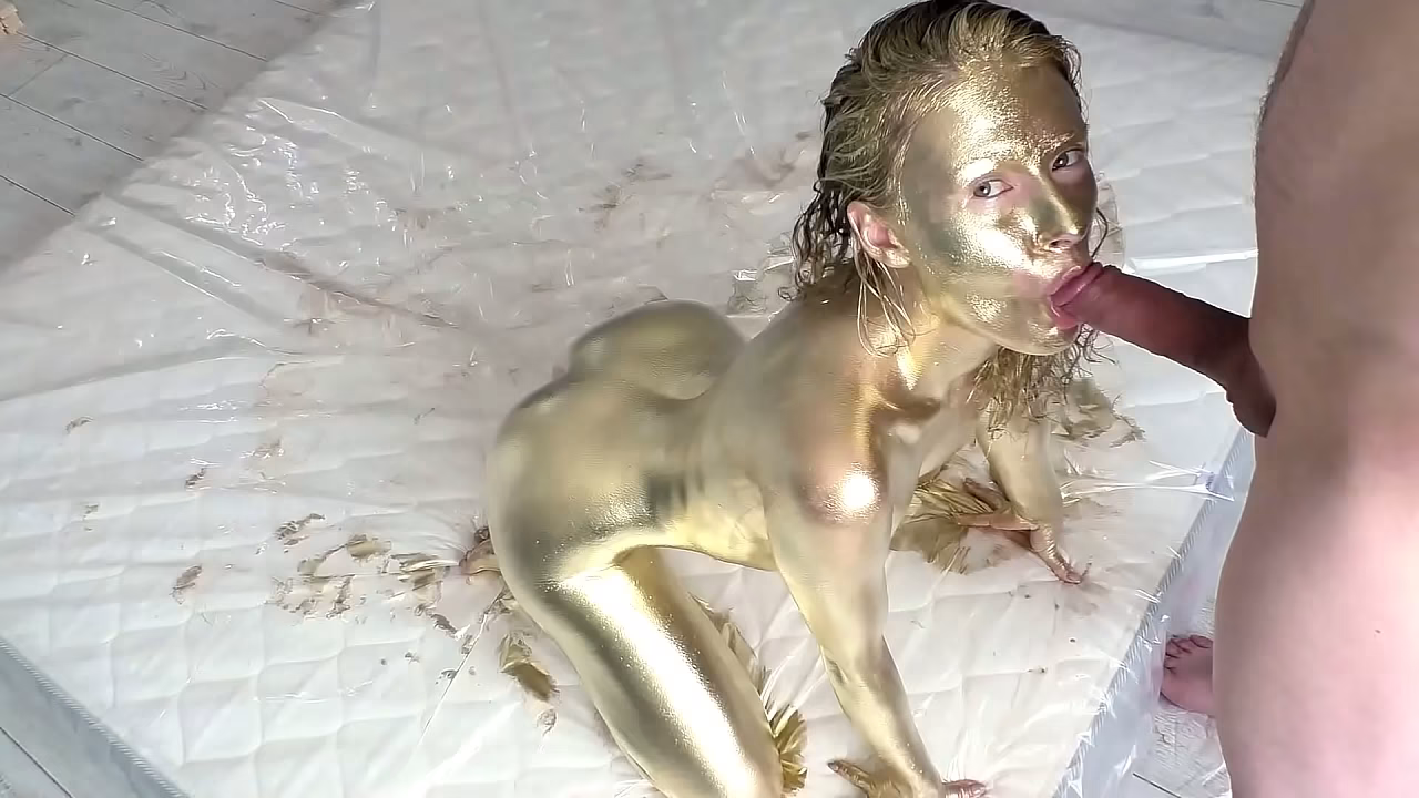 Pretty woman makes herself a golden body art, then gently fucks and sucks a dick, filled the whole body art with sperm