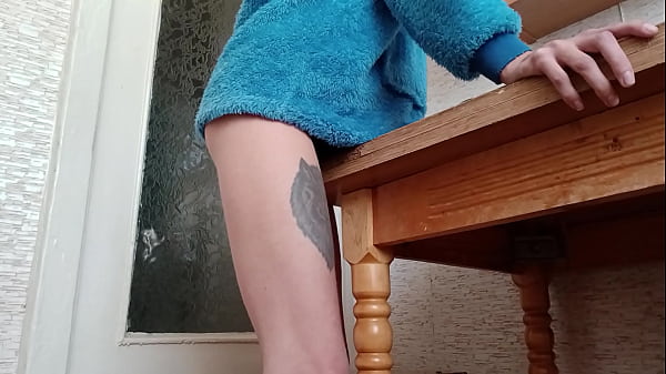 Download Video - Skinny brunette rubs her pussy on the table in the kitchen