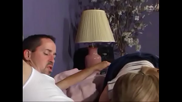 Tattooed stud in a sexy latex suit and stockings inserts a dick in a young slut's mouth before a hot fuck