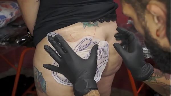 Getting my new tattoo on my ass!