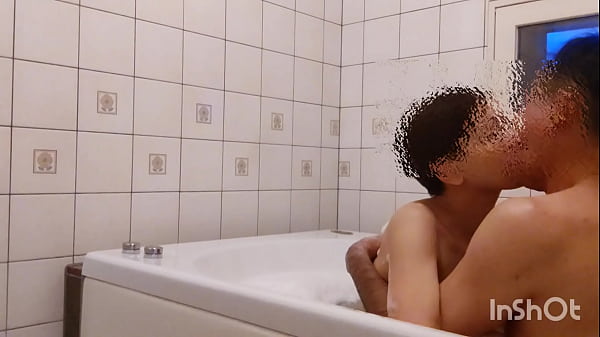 A middle-aged couple is about to take a bath when...
