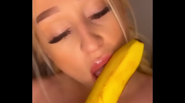 Horny college girl sucks on a banana