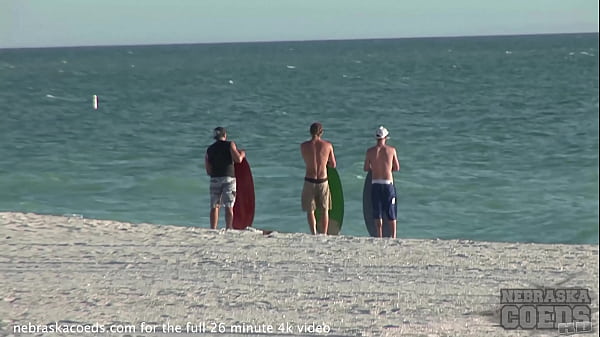 naked old men peeing at the beach