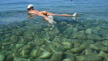 Download Video - At a nudist beach&comma; I&rsquo;m peeking at a beautiful&comma; busty blonde sunbathing in front of everyone