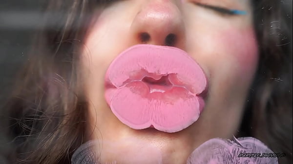 Sensual creamy pink lipgloss kiss