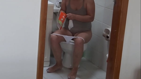 After fucking all night on the beach, stepmom goes to pee and shows off her big hairy pussy