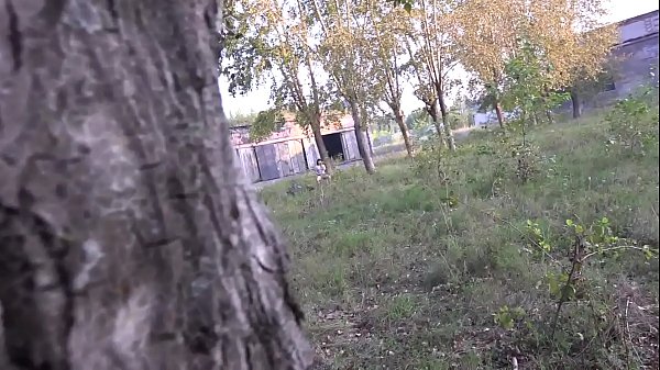 Voyeur in the public park spies on the girl with the anal cork in the juicy ass.