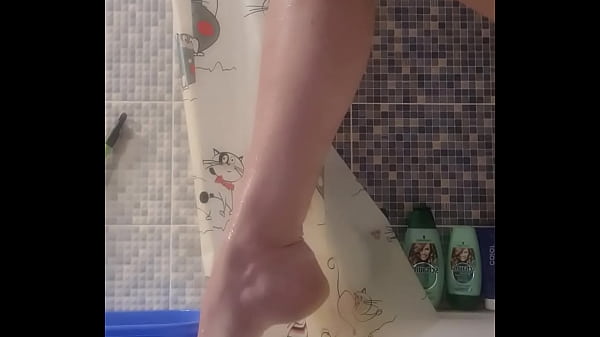 Burning bitch smears cream on her legs in the bathroom