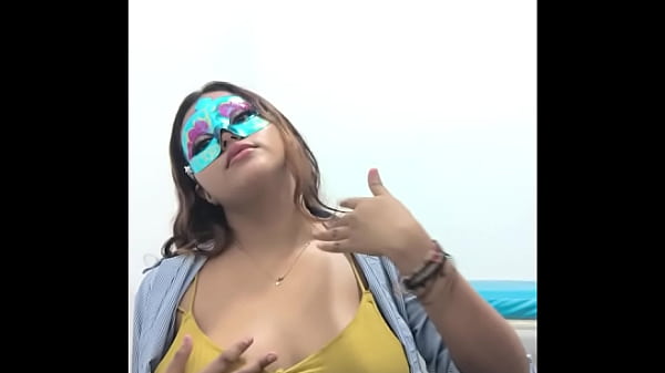 Brunette student takes the questionnaire before going to exams. She touches her breasts in a sexy way.