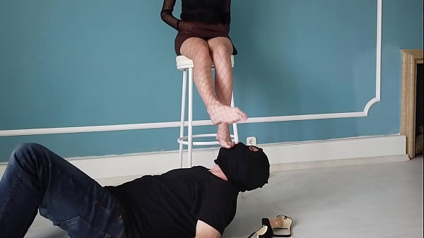 Under her fishnet stockings feet