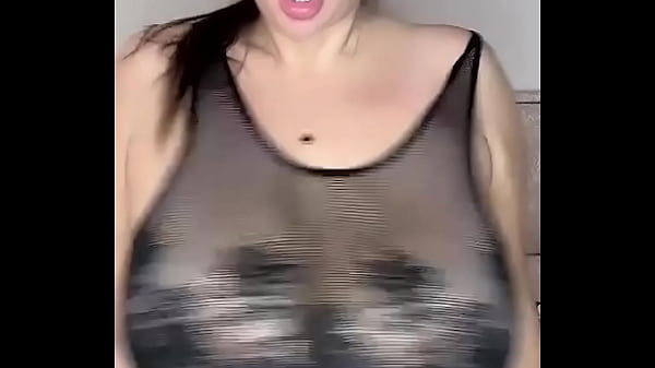 In stockings on the body, mesh fucks huge natural tits from above