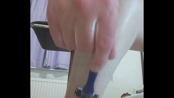 Naked and shaving legs