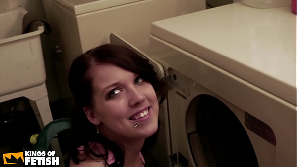 Sexy brunette and her girlfriend kiss and fist their tight holes on the washing machine