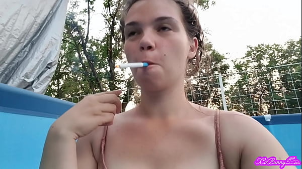 Smoking in bikini while the neighbors are having a party across the street