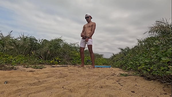 Jerking off and cumming at the beach