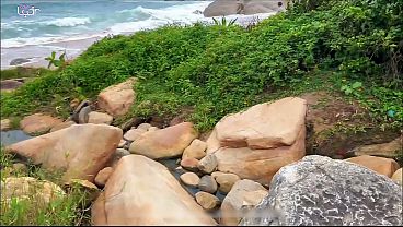 Black man has sex with wife and exhibitionist husband on a nudist beach.