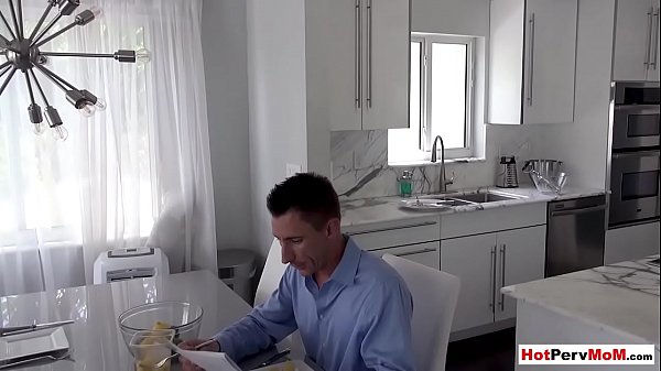 Busty MILF stepmother blows her stepson next to stepdad