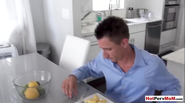 Busty MILF stepmother blows her stepson next to stepdad