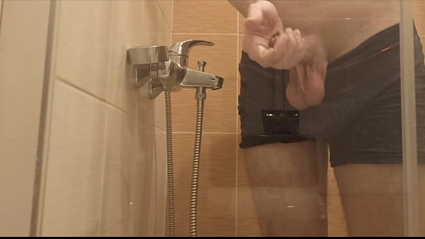 A boy washes in the shower and wants someone to...