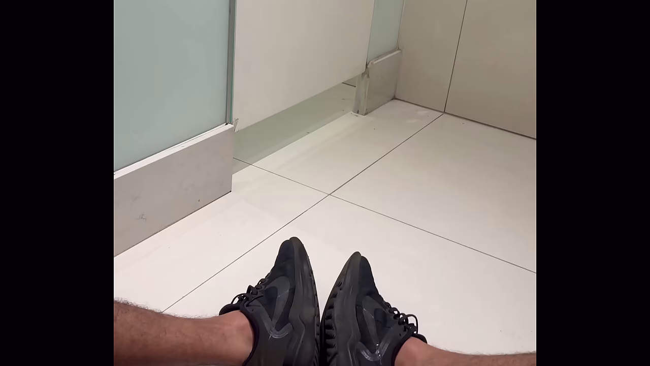 Big, hairy, very hard penis on the bathroom floor of the shopping mall.