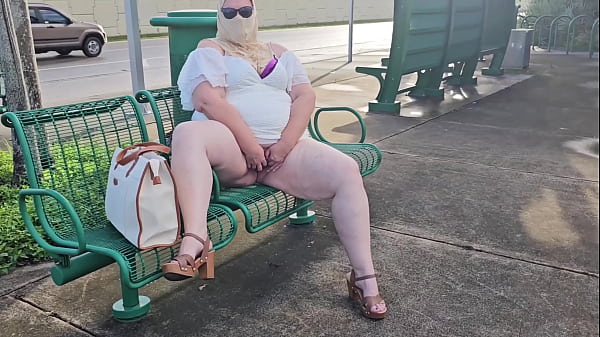 Mature hijab Milf masturbating with big dildo publicly outdoor at bus stop with cars passing by