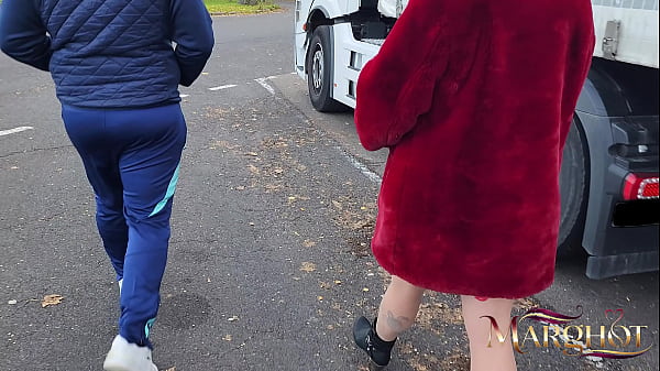 A slutty MILF shows off in a truck stop parking lot and gets fucked by a trucker