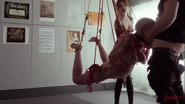 Submissive bondage puppet Rebel Rhyder sucks cock and eats ass in a demented threesome game