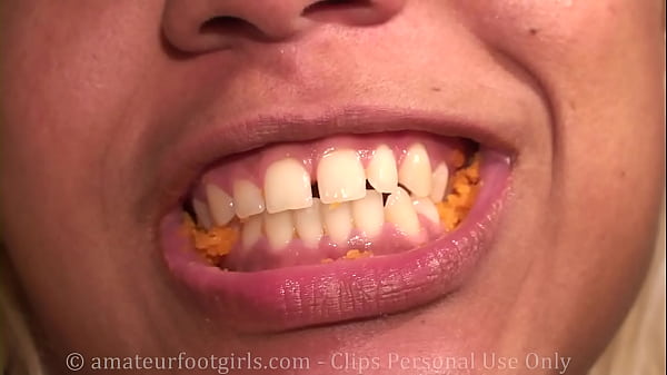 Girl eating blonde with beautiful teeth chewing food chews you really everything very small mastication
