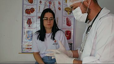 Doctor examined student in the school infirmary.