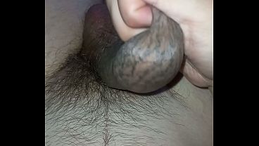 Pulling on the long foreskin of a large, tattooed cock, I came copiously.