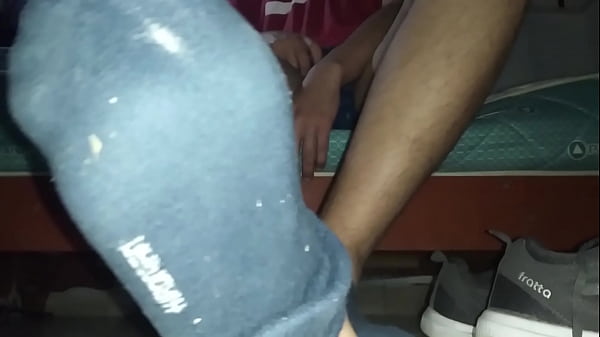 Sweaty blue socks and barefeet in my room