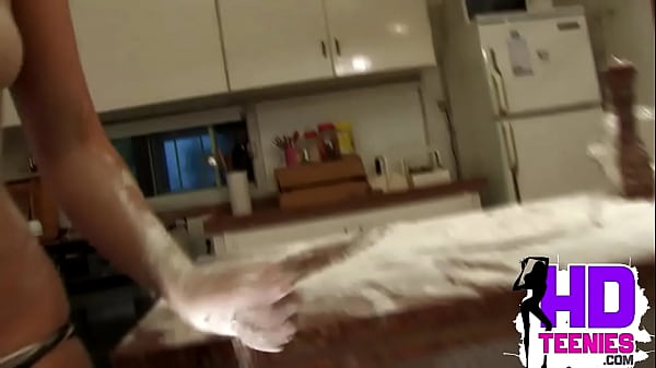 Teen Maid showing her medium tits and ass while baking