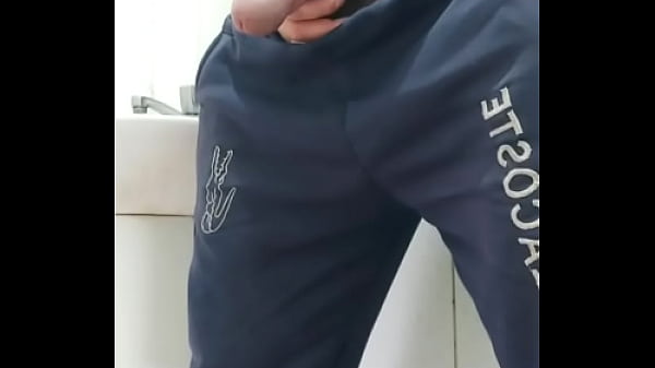 A well-endowed Brazilian man urinating and show...