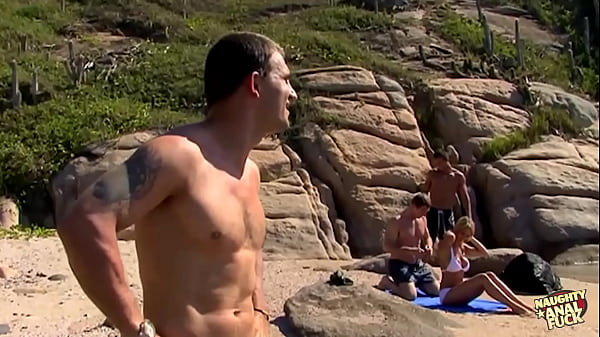 Download Video - Three guys destroy a skinny blondes holes on the beach of an island