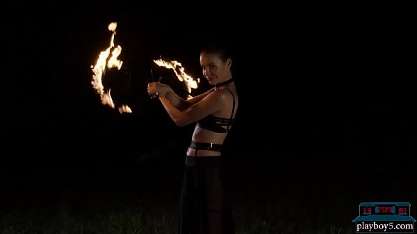 Czech MILF beauty Elilith Noir playing with fire in the nude for Playboy