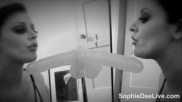 Slut Sophie Dee stuffs her mouth with a big dildo!
