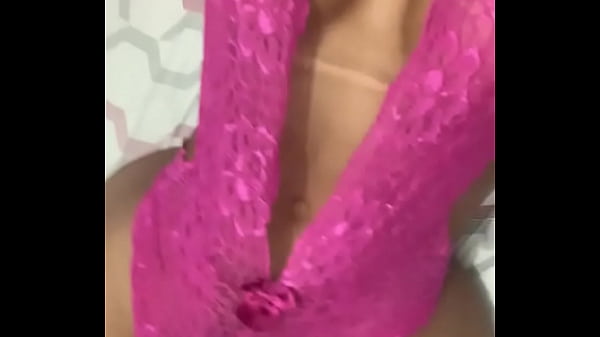 Transex Kelly Portela showing her body in bed