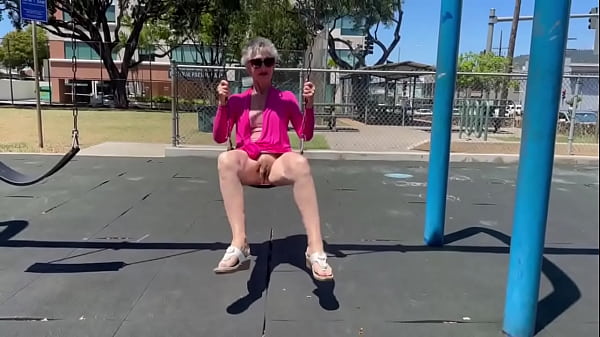 Playing on a swing in Kaimuki. (BTW, this is NOT at a school - and there was nobody nearby.)