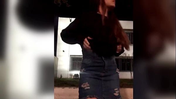 Petite flashing outside of school