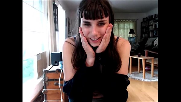 dark haired cutie removes bra and plays with her saggy tits