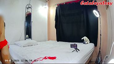 Hot milf puts on a tiny red outfit, sexy devil, and poses for photographer. 1/2